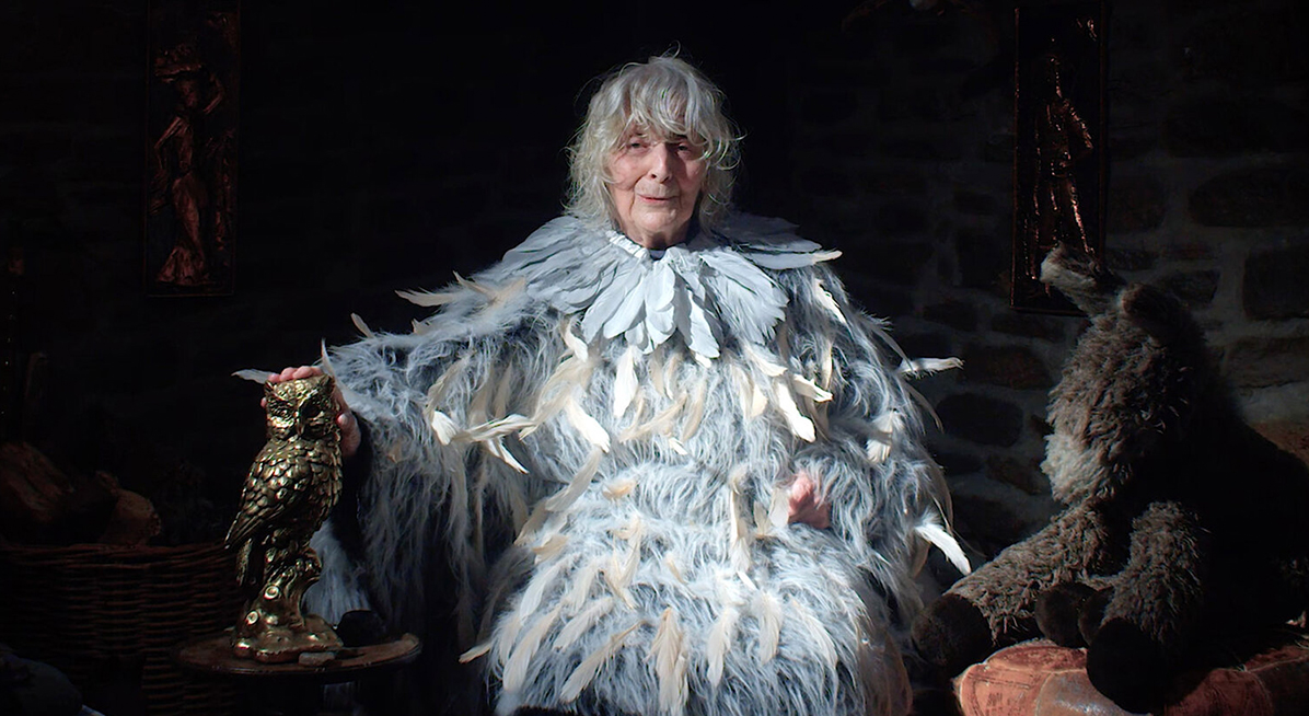 An old woman dressed as an owl